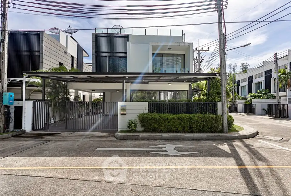Modern luxury house with sleek design and spacious driveway in a serene neighborhood.