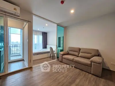 Modern apartment living room with balcony and bedroom view