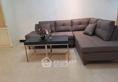 Cozy living room with modern sectional sofa and coffee table