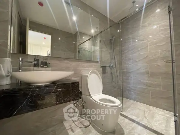 Modern bathroom with sleek design and glass shower enclosure