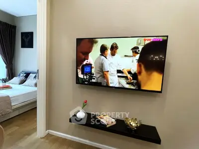 Modern living room with wall-mounted TV and stylish decor