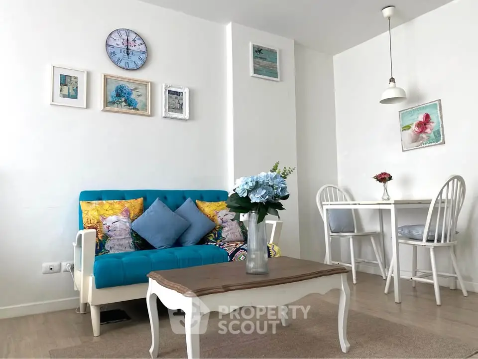 Charming living room with vibrant decor and cozy dining area, perfect for modern living.