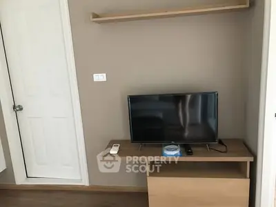 Modern living room with sleek TV setup and minimalist decor