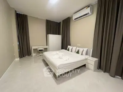 Spacious modern bedroom with minimalist design and air conditioning