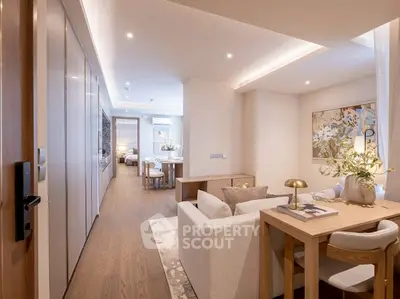 Luxurious open-plan living room with elegant decor and modern lighting in a stylish apartment.