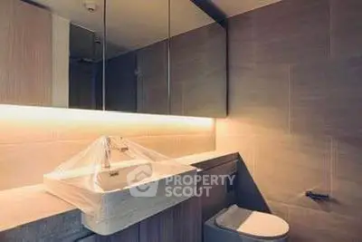 Modern bathroom with sleek design and ambient lighting
