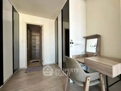Modern bedroom with sleek wardrobe and stylish vanity desk