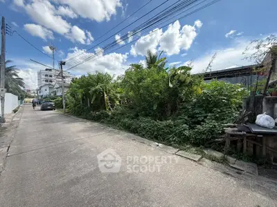 Explore this prime real estate opportunity with lush greenery and potential for development in a serene neighborhood.