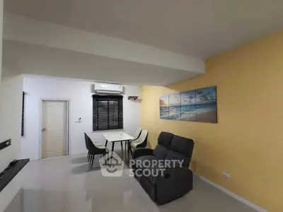 Modern living room with dining area and stylish decor