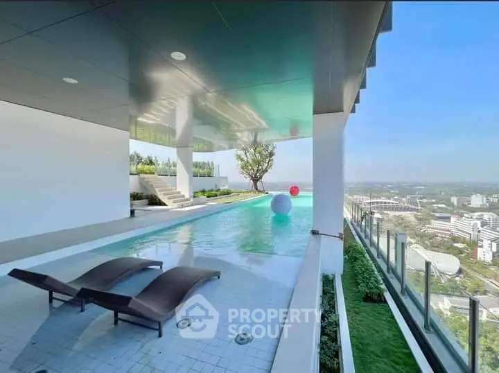 Luxurious rooftop pool with stunning city view and modern design, perfect for relaxation and leisure.