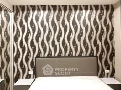 Modern bedroom with stylish wallpaper and sleek headboard design