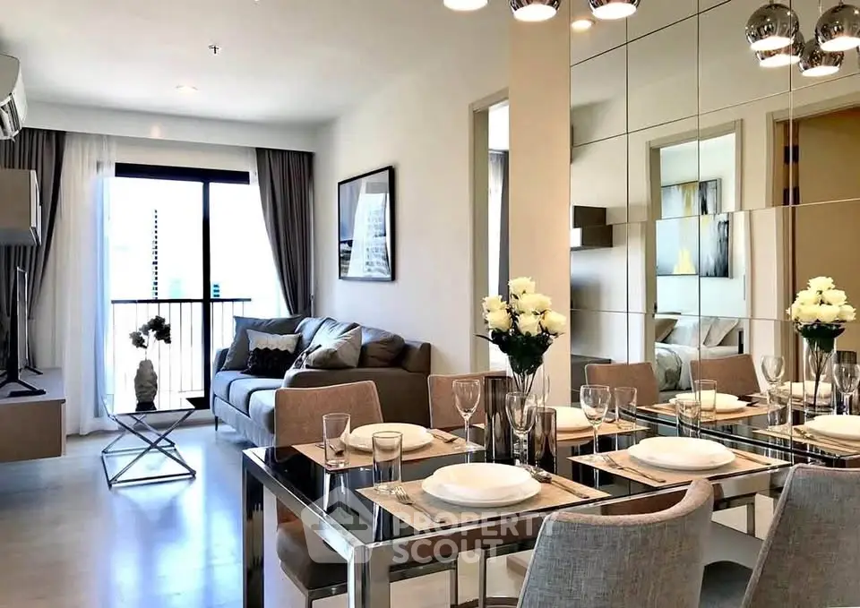 Modern living room with elegant dining area and stylish decor in a contemporary apartment.