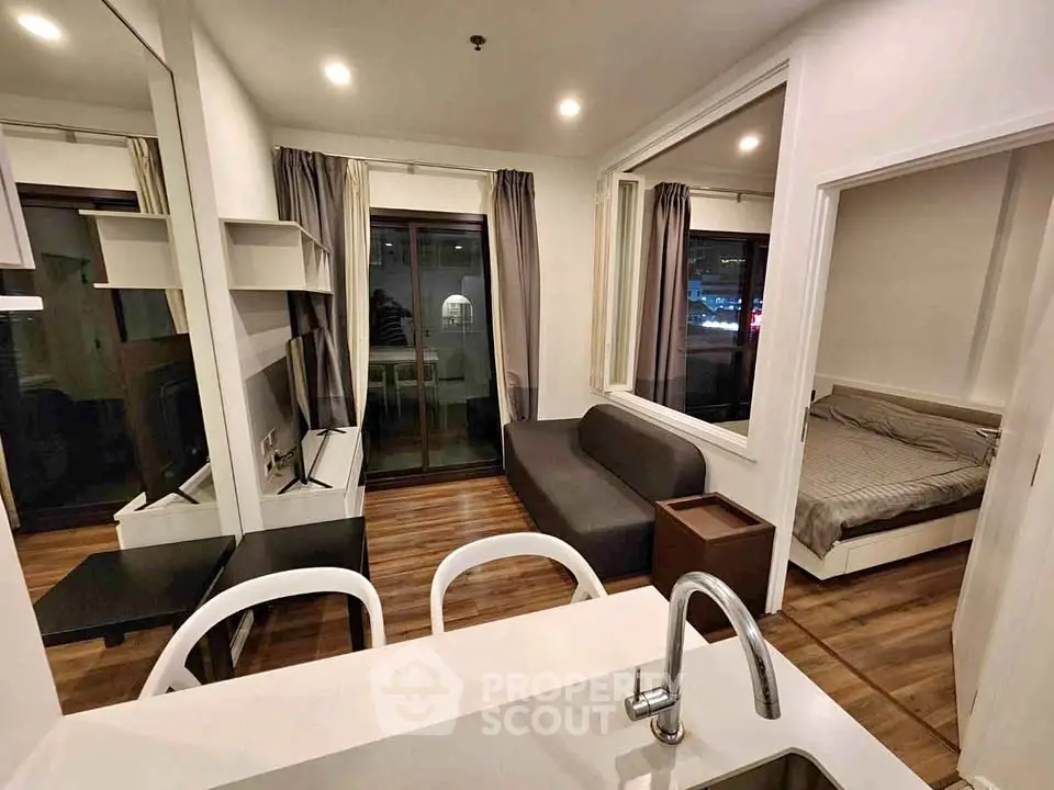 Modern studio apartment with open layout and cozy bedroom area