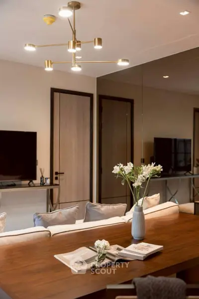Elegant living room with modern chandelier and stylish decor