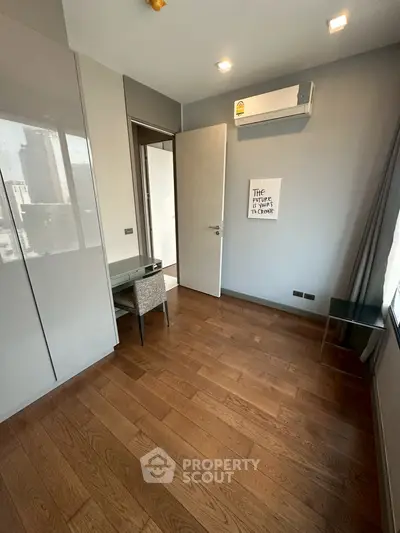 Modern study room with wooden flooring and air conditioning