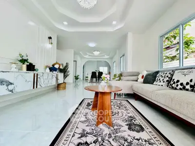 Spacious modern living room with elegant decor and natural light