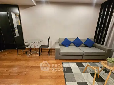 Modern living room with stylish furniture and wooden flooring