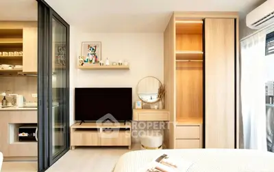 Modern bedroom with stylish decor, open layout, and built-in storage in a cozy apartment.