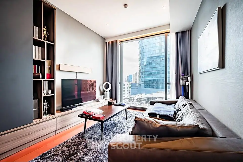 Modern living room with city view, sleek furniture, and floor-to-ceiling windows in a high-rise apartment.