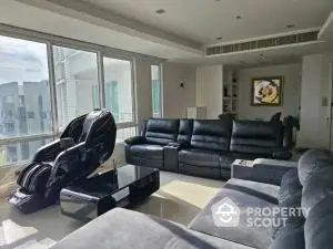 Luxurious living room with massage chair and modern sofas in a bright apartment