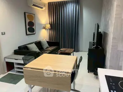 Modern living room with sleek furniture and stylish decor in a cozy apartment setting.
