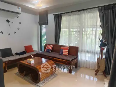 Stylish living room with modern wooden furniture and large window for natural light.