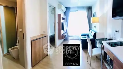 Modern apartment interior with open layout, featuring a cozy living area and stylish kitchen.