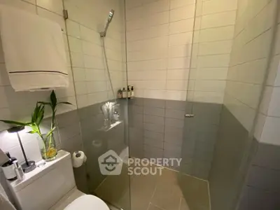 Modern bathroom with glass shower and stylish tile design