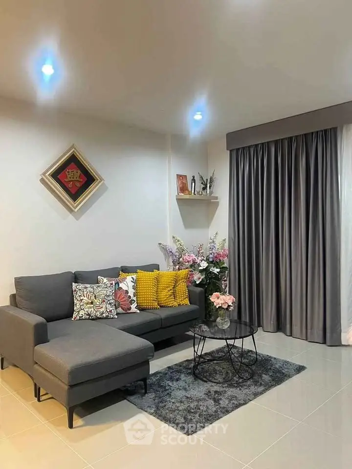 Modern living room with stylish gray sofa and elegant decor
