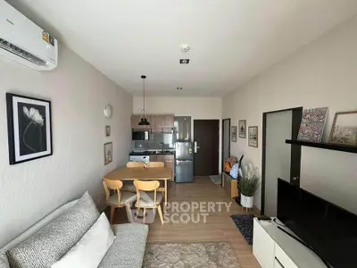 Modern living room with open kitchen and stylish decor