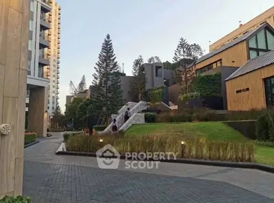 Modern residential complex with lush landscaping and contemporary architecture