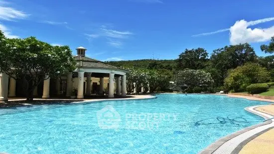 Luxurious outdoor pool with scenic views and lush greenery, perfect for relaxation and leisure.