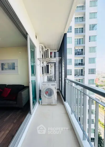 Modern apartment balcony with city view and sleek design