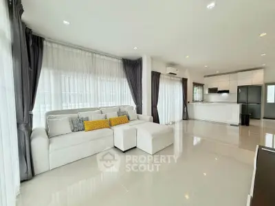 Spacious modern living room with open kitchen and elegant decor