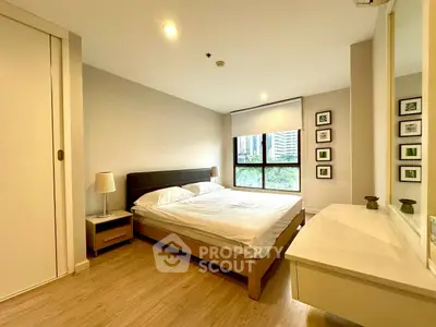 Spacious modern bedroom with large window and stylish decor