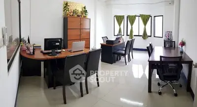 Spacious office space with modern furniture and natural light