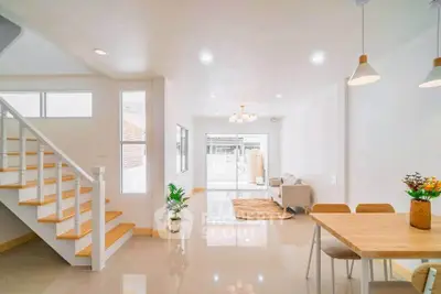 Bright and spacious open-plan living and dining area with modern decor