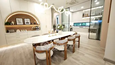 Luxurious modern kitchen with elegant dining area and sleek cabinetry