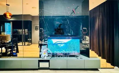 Modern living room with stylish decor and large TV setup