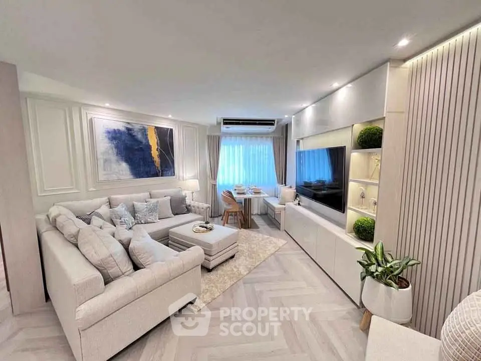 Luxurious modern living room with elegant decor and spacious seating area.