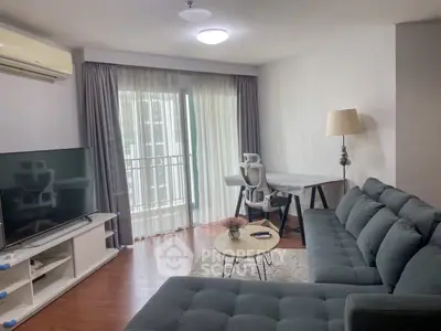 Modern living room with stylish furniture and balcony view