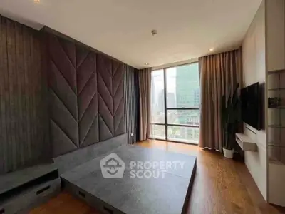 Modern living room with large window and stylish wall design