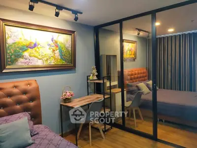 Stylish bedroom with elegant decor and mirrored closet doors