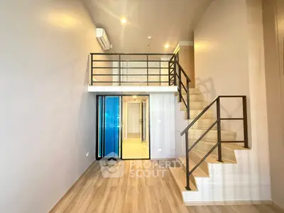 Modern loft apartment with mezzanine and sleek staircase