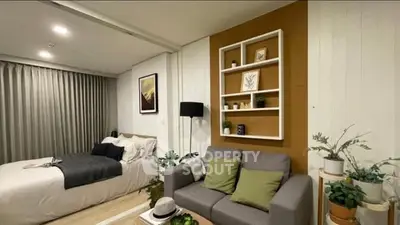 Modern bedroom with cozy living area and stylish decor