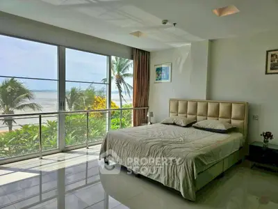 Luxurious beachfront bedroom with stunning ocean views and modern decor