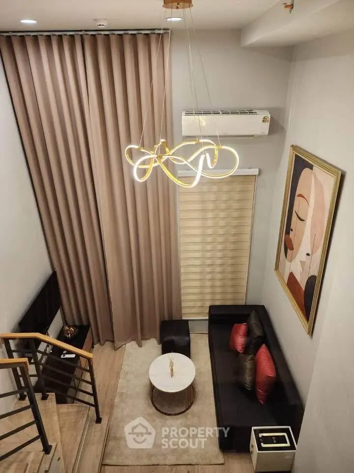 Modern duplex living room with elegant chandelier and stylish decor