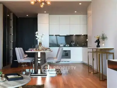 Modern open-plan kitchen and dining area with sleek design and elegant decor