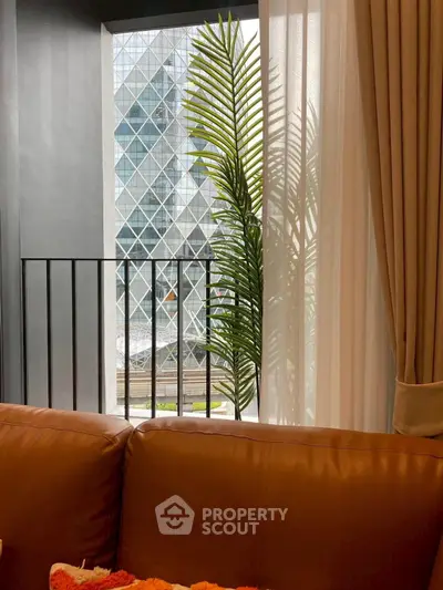 Modern apartment with stylish interior and city view through large window.