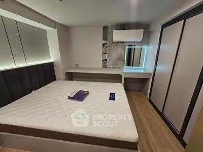 Modern bedroom with stylish decor and built-in storage solutions